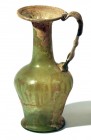 A YELLOWISH GLASS JUGLET Byzantine Period, 4th-5th century CE. 14 cm high. With some nice patina. In very good condition. Ex David Bergman collection,...