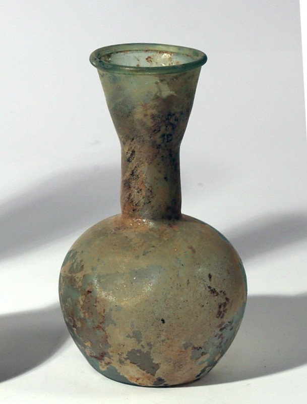 A GLASS BOTTLE Byzantine Period, 4th-5th century CE. 16.7 cm high. In very good ...