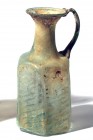 A HEXAGONAL TRANSLUCENT GLASS JUG WITH DIAGONAL LINES BLOWN IN A MOLD Byzantine Period, 5th-6th century CE. 15 cm high. In very good condition. Ex Dav...