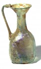 A SQUARE GLASS FLASK Byzantine Period, 5th-6th century CE. 13.6 cm high. Two sides decorated with palm branches and two sides with net pattern. In ver...
