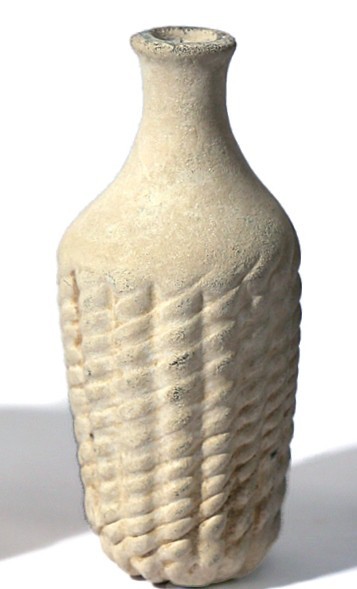 A GLASS FLASK WITH RIBBED BODY Islamic Period, 7th-9th century CE. 9.9 cm high. ...