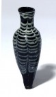 A BLUE AND WHITE GLASS FLASK Islamic Period, 800 – 1200 CE. 8.4 cm high. In very good condition. Ex Abraham Rosen collection, New York.