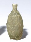 A CUT GLASS KOHL FLASK Islamic Period, 8th-9th century CE. 7.7 cm high. In very good condition. Ex Abraham Rosen collection, New York.