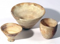 A LOT OF 3 ALABASTER BOWLS Neolithic Period, 8,000 – 6,000 BCE. 24.4, 7.5 and 6.1 cm in diameter. One barrel-shaped and 2 V-shaped. In very good condi...