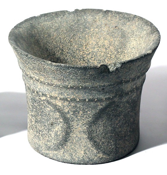 A SMALL BASALT BOWL WITH ROPE DECORATION Chalcolithic Period, 4th millennium BCE...