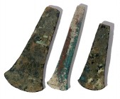 A LOT OF 3 FLAT BRONZE AXES Early Bronze Age, 3100 – 2900 BCE. 15.4-11.7 cm long. In very good condition. Ex Lisa Knothe collection, Jerusalem.