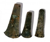 A LOT OF 3 FLAT BRONZE AXES Early Bronze Age, 3100 – 2900 BCE. 15.5-11.7 cm long. In very good condition. Ex Lisa Knothe collection, Jerusalem.