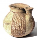 A TERRACOTTA JAR WITH CUP Early Bronze Age, 3100 – 2900 BCE. 10.6 cm high. Decorated with brown net pattern on white. In very good condition. Ex David...