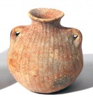 A TERRACOTTA AMPHORISKOS Early Bronze Age, 3100 – 2900 BCE. 10.7 cm high. With 2 handles and linear decoration. In very good condition. Ex David Bergm...