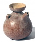 A TERRACOTTA SPOUTED AMPHORISKOS Early Bronze Age I, 3100 – 2900 BCE. 10.9 cm high. Decorated with brown linear pattern. Minor rim chip but in very go...