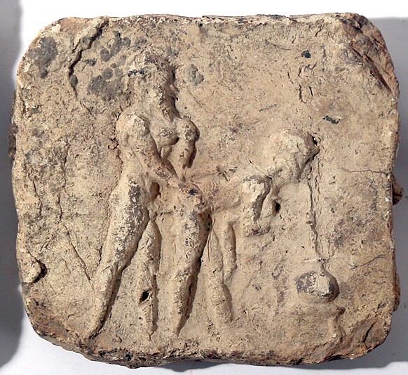 A TERRACOTTA PLAQUE DEPICTING AN EROTIC MOMENT Early 2nd millennium BCE. 9.7x8.5...