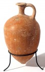 A BROWN TERRACOTTA JUGLET Middle Bronze Age, 1730 – 1550 BCE. 17 cm high. In very good condition. Ex David Bergman collection, Haifa.