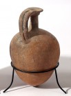 A CANAANITE TERRACOTTA JUGLET Middle Bronze Age, 18th-16th century BCE. 15.2 cm high. In very good condition. Ex Judge Steve Adler collection, Jerusal...