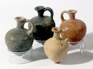 A LOT OF 4 TERRACOTTA JUGLETS Middle Bronze Age II, 1830 – 1550 BCE. 11.1 - 9.4 cm high. In very good condition. For similar juglets see: Ruth Amiran,...