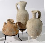 A LOT OF 3 TERRACOTTA VESSELS 2 juglets from the Middle Bronze Age, 18th-17th century BCE, 18.5 and 17.0 cm high and one Pyxis from the Iron Age, ca. ...