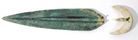 A CANAANITE BRONZE SHORT SWORD BLADE AND A STONE HANDLE TERMINAL Middle Bronze Age, 18th – 17th century BCE. 32.3 cm long. With very nice green patina...