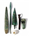 5 CANAANITE BRONZE WEAPONS Middle Bronze Age, 1830 – 1550 BCE. Including two dagger blades, a spear-head terminal, a piercing axe, a duck bill axe and...