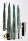 5 CANAANITE BRONZE WEAPONS Middle Bronze Age, 1830 – 1550 BCE. Including 3 dagger blades, a spear-head terminal, a piercing axe and a stone pommel. 37...