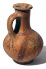 A BICHROME TERRACOTTA JUG Late Bronze Age, ca. 1400 – 1200 BCE. 17.5 cm high. In very good condition.