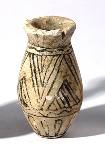 A FAIENCE COSMETIC VESSEL Late Bronze Age, 1550 – 1200 BCE. 5.5 cm high. With bl...