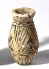 A FAIENCE COSMETIC VESSEL Late Bronze Age, 1550 – 1200 BCE. 5.5 cm high. With black linear decoration. With small rim damage but in good condition. Ex...