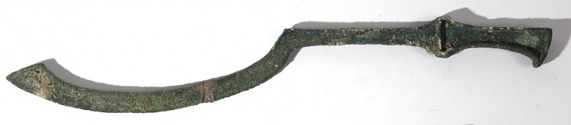 A CAST BRONZE SICKLE-BLADE SWORD Late Bronze Age, 16th-12th century BCE. 59 cm l...