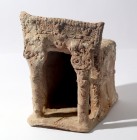 A TERRACOTTA TEMPLE MODEL Iron Age II, 9th-8th century BCE. 25 cm high, 19 cm wide, 22 cm deep. The entrance is supported by two pillars topped by pro...