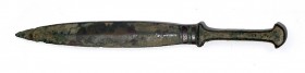 A CANAANITE BRONZE DAGGER Late Bronze Age, 16th – 13th century BCE. 33.6 cm long. With very nice brown patina and in very good condition. Ex Lisa Knot...