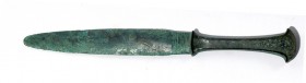 A CANAANITE BRONZE DAGGER Late Bronze Age, 16th – 13th century BCE. 28.4 cm long. With very nice green patina and in very good condition. Ex Lisa Knot...
