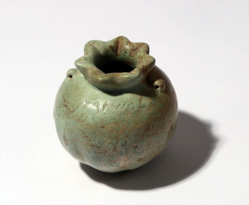 AN INSCRIBED PHOENICIAN GLAZED FAIENCE POMEGRANATE ARYBALLOS Iron age II, 7th-6t...