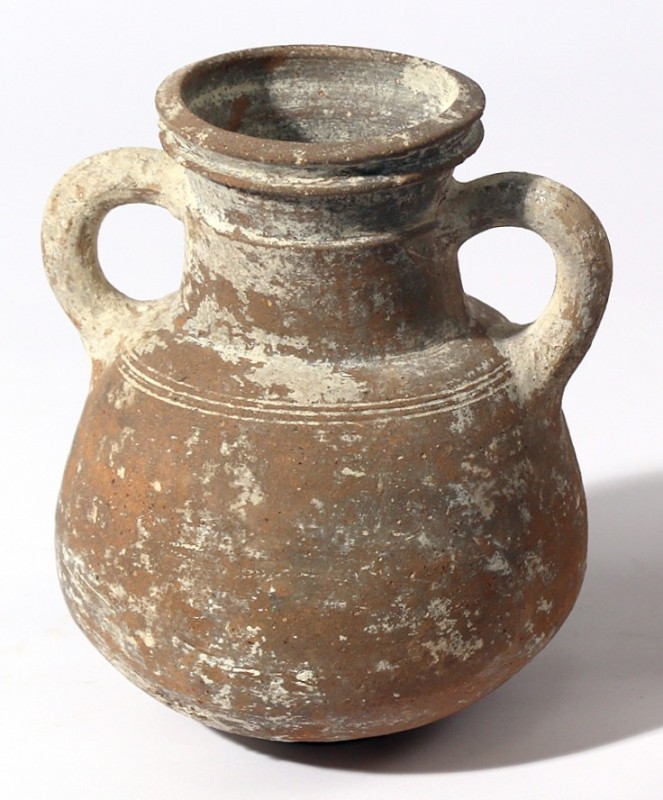 A TERRACOTTA JUG Iron Age II, ca. 8th century BCE. 15.3 cm high. In very good co...