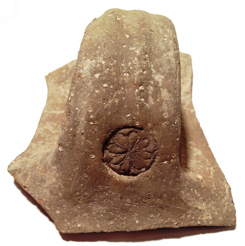 A TERRACOTTA JAR HANDLE IMPRESSED BY A SEAL DEPICTING A ROSETTE 7th century BCE,...