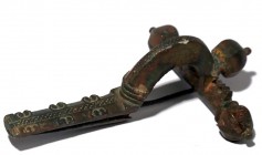 A ROMAN BRONZE FIBULA 4th century CE. 9.2 cm. With very nice brown patina and in very good condition. Ex Yoav Sasson collection, Jerusalem.