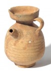 A TERRACOTTA JUGLET WITH SPOUT Roman Period, ca. 1st century CE. 10.2 cm high. In very good condition. Ex Judge Steve Adler collection, Jerusalem.