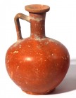 A RED SLIP TERRACOTTA DECANTER Roman period, 4th century CE. 21.7 cm high. In very good condition.