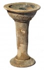 A TERRACOTTA TORCH Roman Period, 1st-4th century CE. 18.2 cm high. In very good condition. Ex Amiram Aharonowitz collection, Holon.