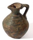 A SMALL BRONZE JUGLET 1st or early 2nd millennium CE. 5.3 cm high. With very nice patina and in very good condition. Ex Yoav Sasson collection, Jerusa...