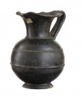 Etruscan Bucchero Oinochoe, 7th - 6th century BC; height cm 20; Restored with minor reconstructions. Provenance: From the collection of a Belgian gent...