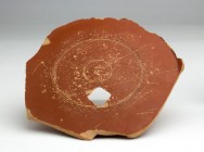 Roman Arretine Terra Sigillata Dish bottom with Stamp, 1st century AD; diam cm 14,7; With a square hole. Provenance: English private collection.