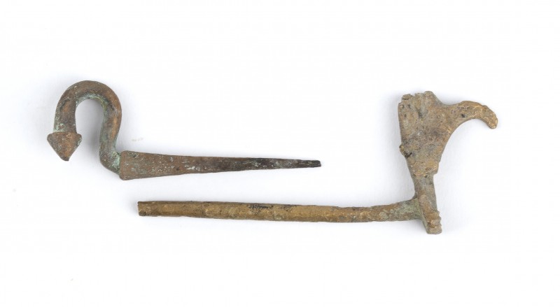 Two Roman Bronze Naval Nails, one in shape of a Prow, 1st - 2nd century AD; leng...