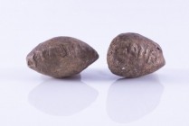 Couple of Greco-Roman Inscribed Lead Sling Bullets, 2nd century BC - 2nd century AD; ca. mm 25 each. Provenance: English private collection.
