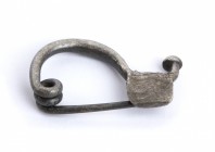Small Greek Silver Fibula, 5th - 4th century BC; length cm 2,5; Crystallised metal. Provenance: Swiss private collection, 1970s-1980s.