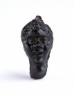 Roman Glass Blackmoor Head Pendant, 1st century BC - 1st century AD; height mm 17; Missing hook. Provenance: Swiss private collection, 1970s-1980s.