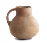 Near Eastern Terracotta Handled Juglet, 10th - 8th century BC; height cm 10. Provenance: From the Amedeo Guillet collection.