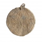 Medieval Pilgrim's Islamic Lead Circular Amulet, 11th -14th century; diam cm 3,5; Usually this kind of amulet was worn as charms on necklaces or tied ...