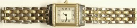 Armbanduhren
Damenuhr JAEGER LE COULTRE REVERSO. Ausführung 265.5.08 mit 64 Brillanten auf der Lunette des umklappbaren Gehäuses (für Gravur), Gelbgo...