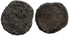 UMAYYAD: AE fals (2.22g), MM, DM, A-L206, kalima obverse, possibly additional legend in the margin, but off flan on this piece // governor's name, mim...