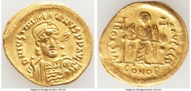 Justinian I the Great (AD 527-565). AV solidus (22mm, 4.30 gm, 6h). XF. Constantinople, 10th officina, AD 527-538. D N IVSTINI-ANVS PP AVG, helmeted, ...