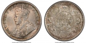 British India. George V 1/2 Rupee 1916-(c) MS65+ PCGS, Calcutta mint, KM522, SW-8.78. Muted mint bloom with overall gray toning draped in peach and se...