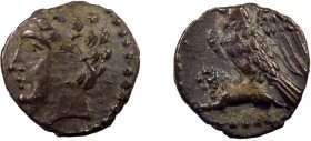 Greek, Cilicia, c. 4th Century BC, AR Obol, uncertain
0.64 g, 10 mm, aVF, toned

Obverse: Youthful male head left, wearing grain wreath
Reverse: Eagle...